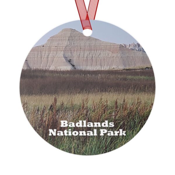 Reeds ornament featuring Badlands National Park landscape, 3.5-inch aluminum design with red ribbon