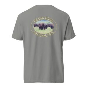 Grey Comfort Colors heavyweight T-shirt featuring a scenic image of wild buffalo grazing at Grand Teton National Park, framed in an oval border.