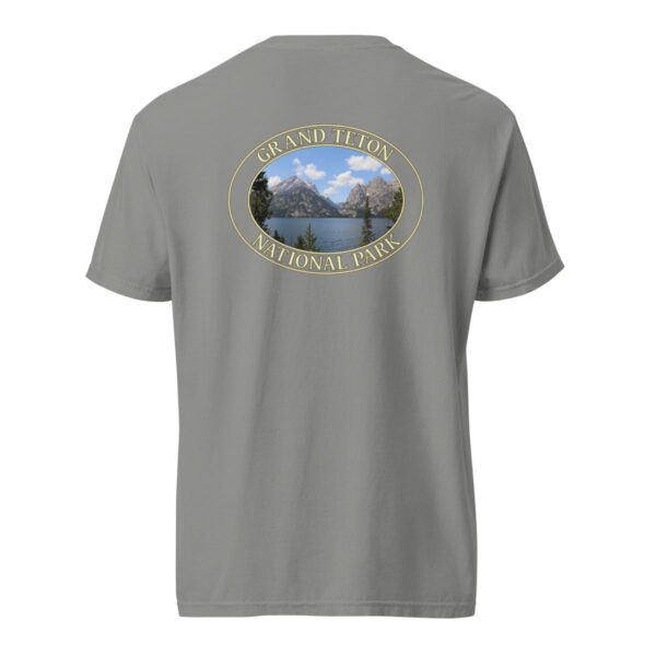 Grey Comfort Colors heavyweight T-shirt featuring a scenic image of Jenny Lake at Grand Teton National Park, framed in an oval border.