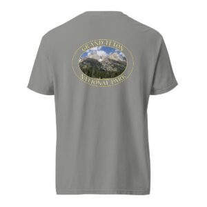 Grey Comfort Colors heavyweight T-shirt featuring a scenic image of the Grand Teton Mountains at Grand Teton National Park, framed in an oval border.