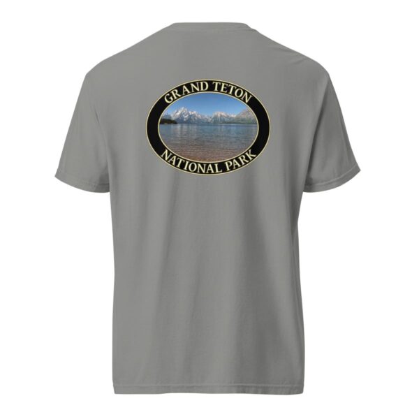 Grey Comfort Colors heavyweight T-shirt featuring a scenic image of Jackson Lake at Grand Teton National Park, framed in an oval border.