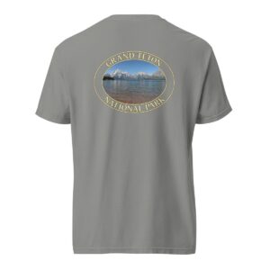 Grey Comfort Colors heavyweight T-shirt featuring a scenic image of Jackson Lake at Grand Teton National Park, framed in an oval border.