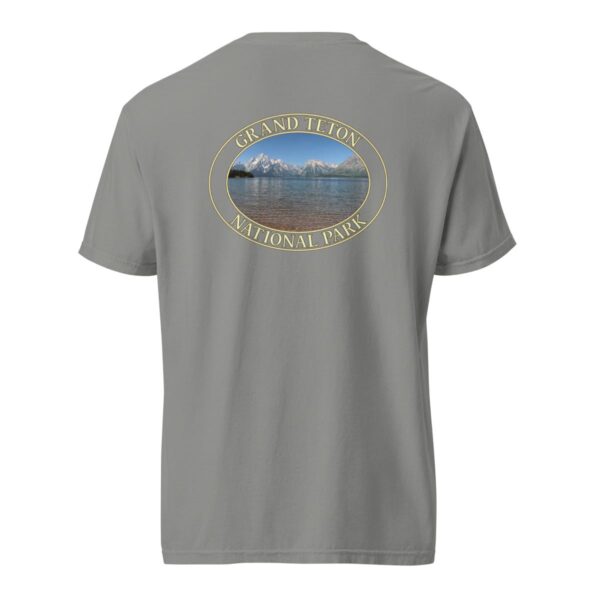 Grey Comfort Colors heavyweight T-shirt featuring a scenic image of Jackson Lake at Grand Teton National Park, framed in an oval border.