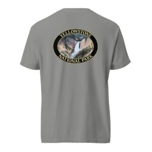 Grey Comfort Colors heavyweight T-shirt featuring a scenic image of Lower Yellowstone Falls at Yellowstone National Park, framed in an oval border.