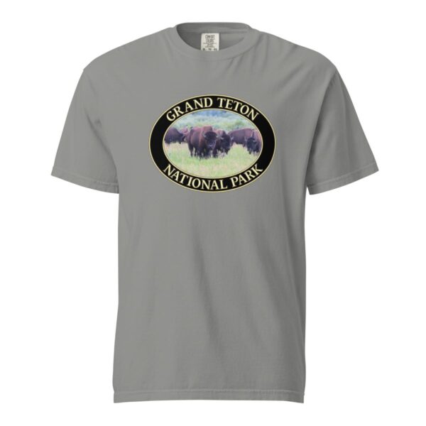 Grey Comfort Colors heavyweight T-shirt featuring a scenic image of wild buffalo grazing at Grand Teton National Park, framed in an oval border.