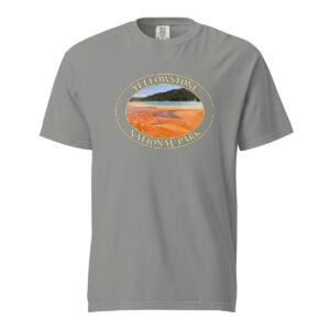 Grey Comfort Colors heavyweight T-shirt featuring a vibrant image of the Grand Prismatic Spring at Yellowstone National Park, framed in an oval border.