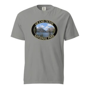 Grey Comfort Colors heavyweight T-shirt featuring a scenic image of Jenny Lake at Grand Teton National Park, framed in an oval border.