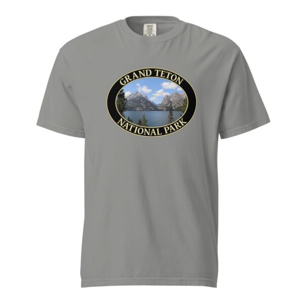 Grey Comfort Colors heavyweight T-shirt featuring a scenic image of Jenny Lake at Grand Teton National Park, framed in an oval border.