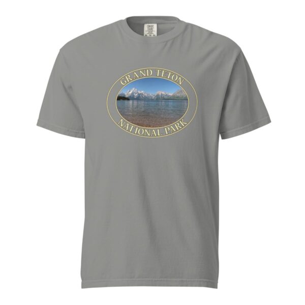 Grey Comfort Colors heavyweight T-shirt featuring a scenic image of Jackson Lake at Grand Teton National Park, framed in an oval border.