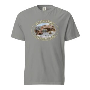 Grey Comfort Colors heavyweight T-shirt featuring a scenic image of Mammoth Hot Springs terraces at Yellowstone National Park, framed in an oval border.