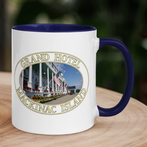 Grand Hotel Mackinac Island Michigan coffee mug featuring historic architecture and a scenic front porch, with a colorful handle and interior.