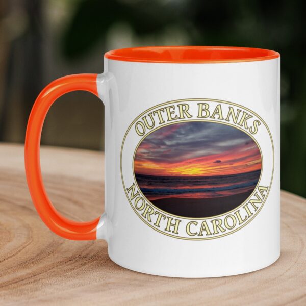 Outer Banks sunrise coffee mug featuring a vibrant sunrise over the Atlantic Ocean in Kitty Hawk, North Carolina.