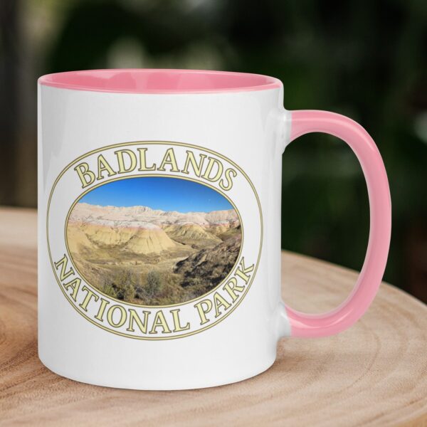 Yellow Mounds at Badlands National Park coffee mug featuring vibrant, colorful rock formations and a clear blue sky.