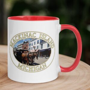 Horse and carriage in downtown Mackinac Island Michigan coffee mug featuring historic streets, with a colorful handle and interior.