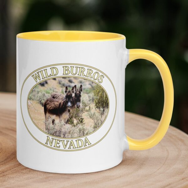 Wild donkeys in the Nevada desert coffee mug featuring a scenic photo of two wild burros grazing, with a colorful handle and interior.