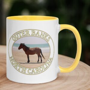 Outer Banks wild horse coffee mug featuring a wild Spanish Mustang on a sandy beach in North Carolina.