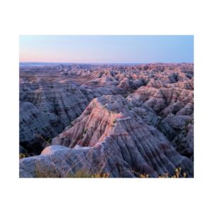 Sunrise Glow over Badlands National Park South Dakota | Fine Art Print of Desert Cliffs, Pastel Sky, and Eroded Buttes | Collectible National Park Wall Décor for Nature and Landscape Enthusiasts